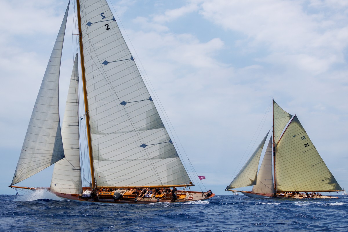Two classic yachts racing side by side at the Puig Vela Clàssica Barcelona regatta