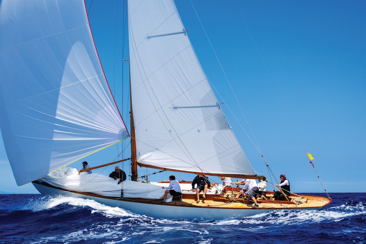 Vintage sailing yacht with white sails at the Puig Vela Clàssica Barcelona
